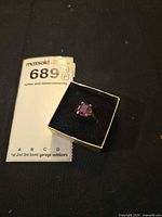Ring in presentation box with lot card