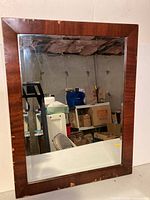 Full view of mirror showing frame color, size and overall condition