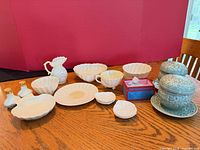 Group shot of all porcelain and ceramic pieces on table
