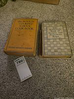 Front covers of both cookbooks showing titles and overall wear