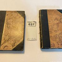 Two half-leather Emerson essay volumes front covers visible