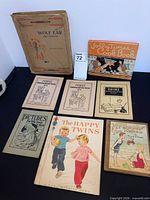 Group shot of all eight books front covers visible