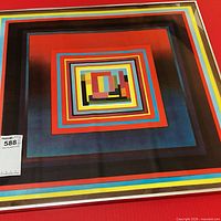 Framed abstract geometric print showing full artwork and frame