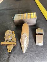 Group shot of all four items aligned on surface next to tape measure