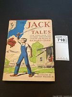Front of dust jacket showing title, author, illustration, inventory tag