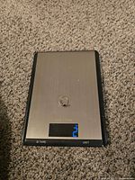 Ring on digital scale displaying weight