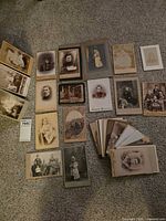 Group shot of all photographs fanned out on carpet