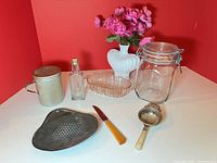 Group shot of all seven vintage kitchenware and glassware items