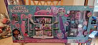 Front view of boxed Gabby's Dollhouse toy set showing dollhouse playset, 3 figures, and accessories in colorful packaging