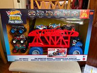 Front view showing large Monster Mover truck with 6 Monster Trucks inside original box packaging