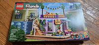 Front of sealed Lego Friends 41747 set box showing community kitchen building with minifigures and number of pieces