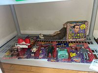 Shelf display showing all packaged figures, View-Master and fun pack box