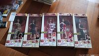 Full set of five Spice Girls dolls in original boxes arranged side by side showing front panels.