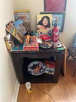 Overview of 13 Wonder Woman collectibles arranged on table