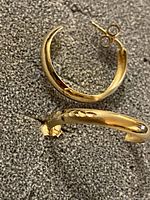 Front and back view of both gold C-hoop earrings showing overall design and butterfly back