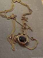 Full necklace showing pendant, chains and inset stones