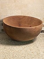 Exterior side view of cherry wood bowl