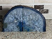 Pair of blue agate bookends standing upright, polished faces meeting