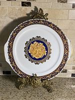 Front view of Limoges Bacchus plate on stand