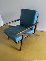 Full view of teal leather lounge chair