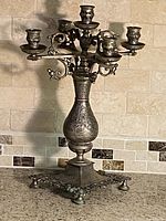 Front view of brass 5-arm candelabra