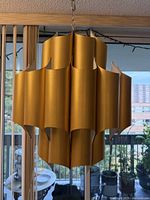 Full view of hanging gold cathedral chandelier