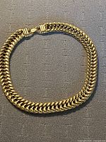 Full view of necklace laid flat with box clasp visible