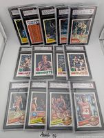 All 13 graded Topps basketball cards arranged in two rows.