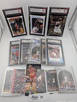 Three graded Michael Jordan cards in slabs (Collector's Choice, NBA Hoops All-Star, Fleer Metal)