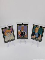 Three Prostars cereal collectible cards in protective cases, featuring cartoon Michael Jordan, Wayne Gretzky, and Mom characters.