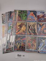 Multiple pages of 1993 Marvel Masterpieces trading cards showing a variety of characters in protective sleeves.