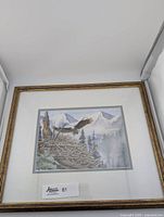 Frontal photo of the framed eagle print showing the entire artwork, matting and gold-toned frame.