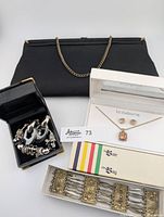 Full lot layout showing Pandora bracelet, Alpaca bracelet, Liz Claiborne jewelry set, and vintage black clutch bag