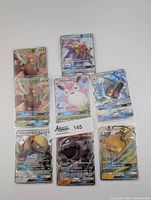 All eight Full Art GX Pokémon cards arranged in two rows, each card showing detailed artwork and foil finish.