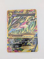 Front of Mega Rayquaza EX card on white background showing holo foil detail