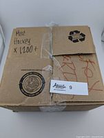 Closed cardboard box labeled 'Misc Hockey x 1200+' containing over 1200 NHL hockey cards
