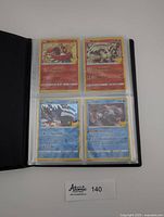 Binder page showing four Legendary ex cards: Moltres ex, Reshiram ex, Kyogre ex, Palkia ex
