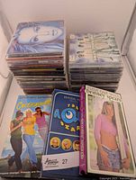 Stacks of 26 CDs including pop icons and 3 VHS tapes featuring Britney Spears and Aqua Diary