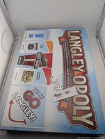 Top view of the Langleyopoly board game box showing the sealed packaging and distinctive branding.