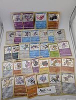 Overview photo showing all 31 shiny Pokemon cards arranged in rows on a white background.