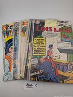 Stack of 8 vintage Superman's Girlfriend Lois Lane comic books from 1966 to 1973, showing front covers with colorful classic comic book art.
