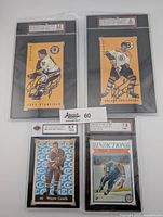 Four graded signed cards arranged with Kurtenbach and Stanfield cards on top and Coffey and Conolly cards below, showing overall lot contents and condition.