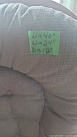 Close-up of blue cushion with handwritten note indicating dimensions: 40" height, 24" width, 18" depth
