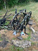 Full view of the two-bottom plow showing frame, blades, and weathering.