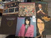 Photo of six 60s LP vinyl albums showing cover artwork from various artists including Jesus Christ Superstar, Frank Sinatra, Neil Diamond, and others.