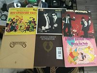 Overview of 6 LP vinyl albums including Disney Best Loved Fairy Tales, Blues Brothers, Carpenters, Jesus Christ Superstar, and Winnie the Pooh Birthday Party.