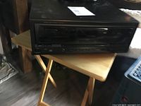 Side angled view of Technics CD changer showing overall unit condition and design.