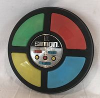 Front view showing four colored pads and control panel