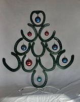 full view of welded horseshoe tree with ornaments