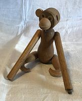 Front view showing teak monkey with detached arms